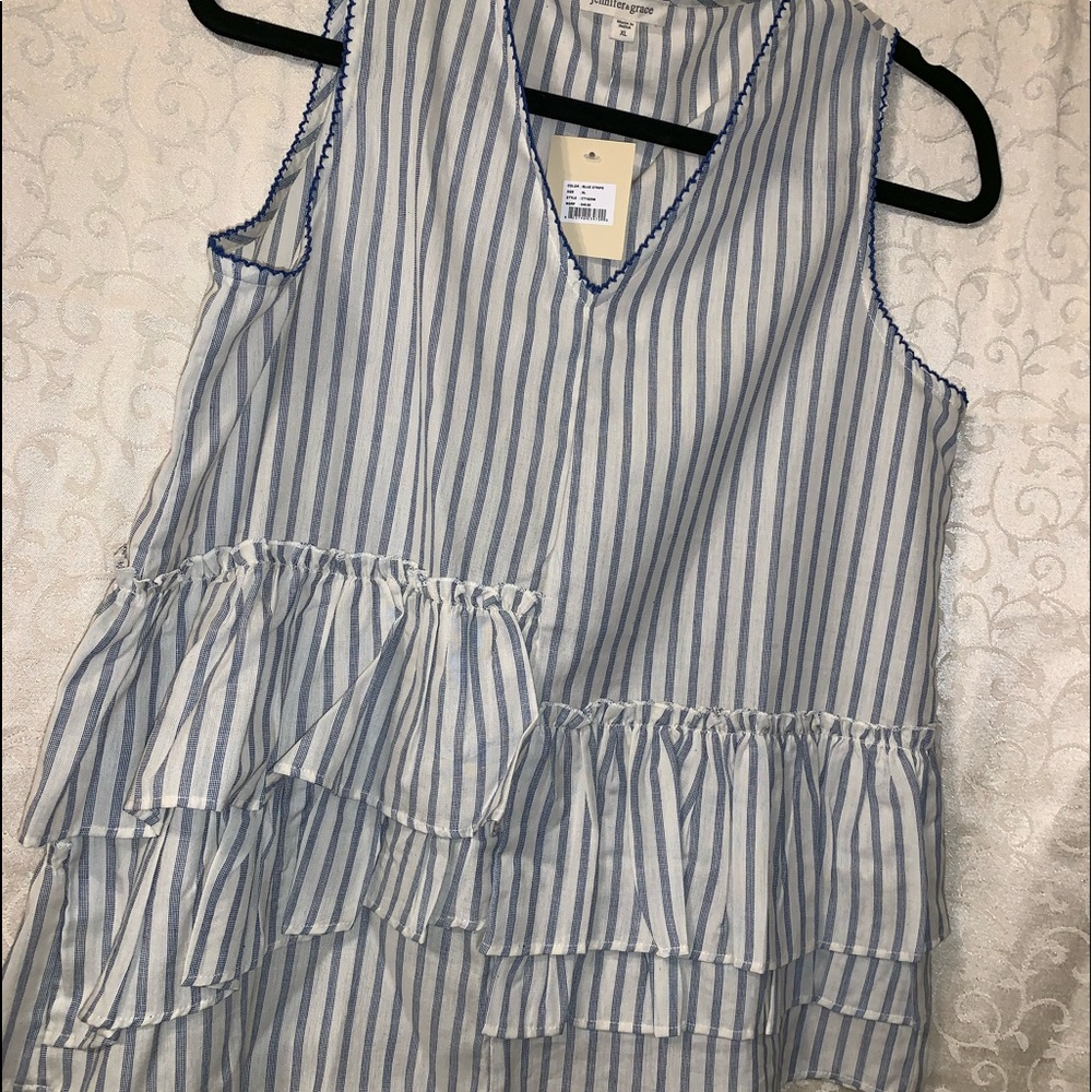 Sleeveless blue and white striped women’s top.